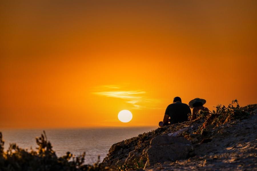 A couple enjoying the sunset in Crete